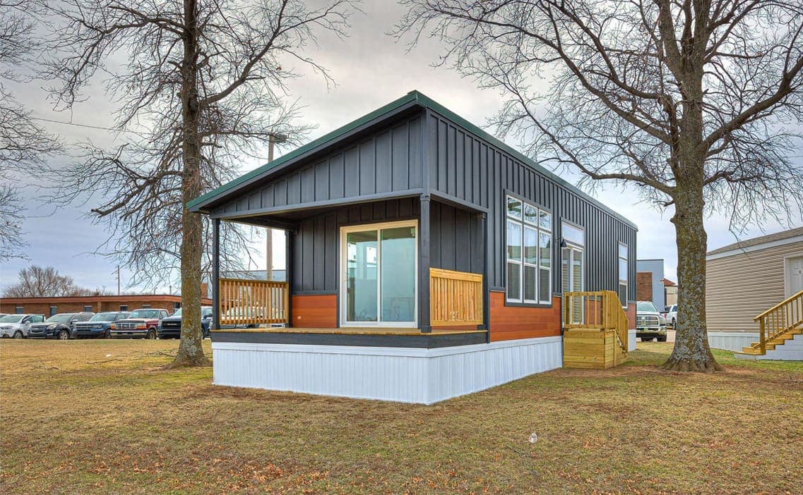 A Premier Midwest Homes manufactured home with a covered front porch